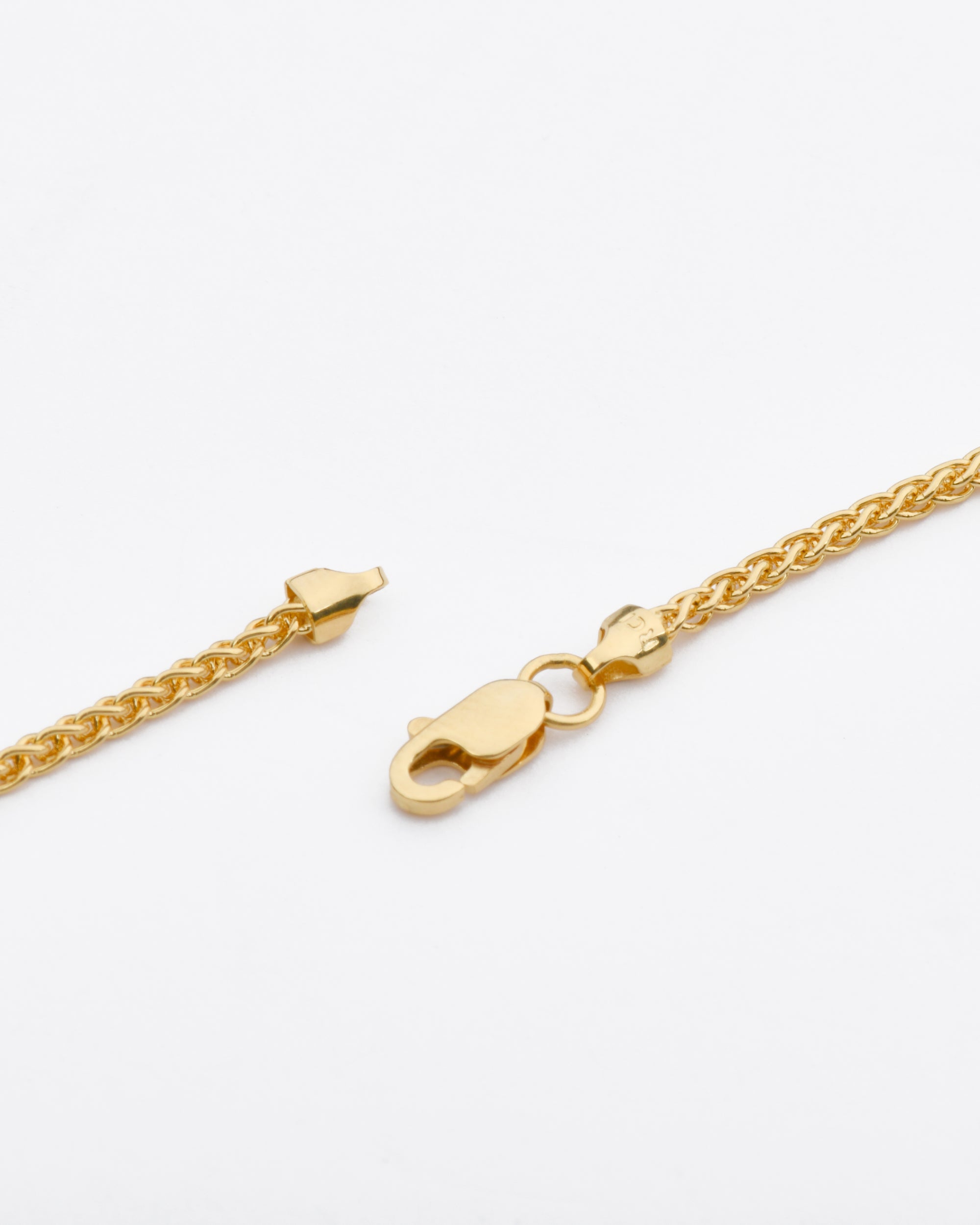 high end 14K gold wheat chain necklace showing detail of lobster clasp and texture of the chain