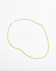 classic 14 karat gold wheat chain necklace on white background