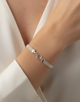 Sterling silver bracelet with a mesh style chain featuring a circular hinge clasp, by Sincerely Chain Co.