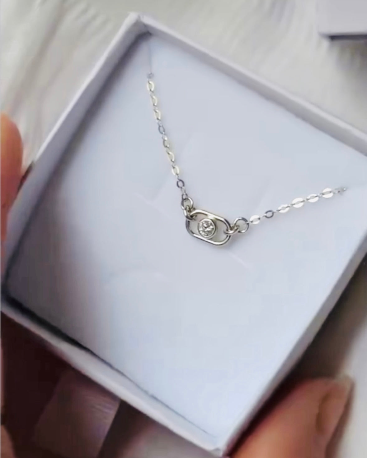 silver and diamond pendant necklace in white gift box