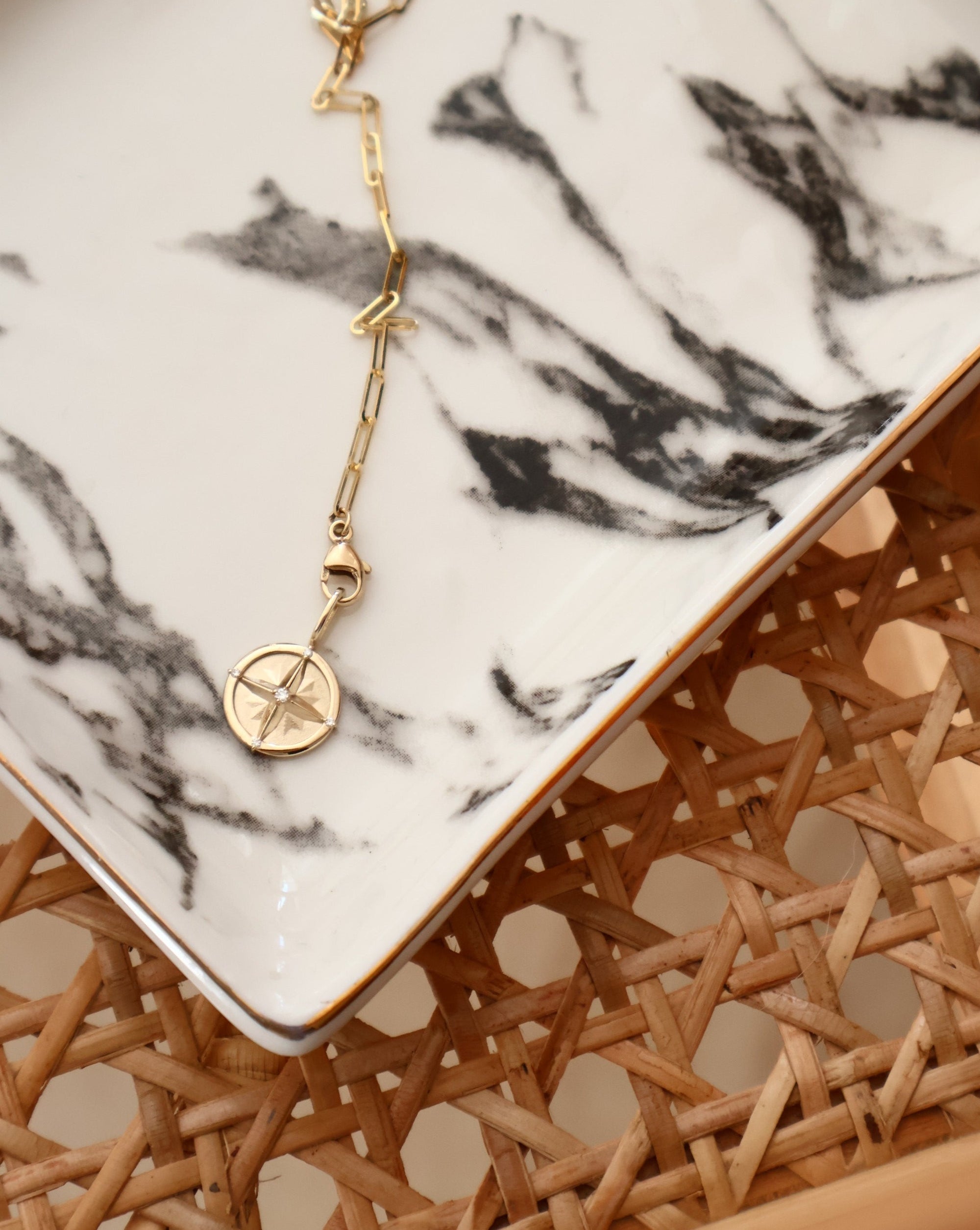 gold paperclip chain with diamond pendant featuring five diamonds