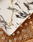 gold paperclip chain with diamond pendant featuring five diamonds