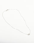silver necklace with dainty round diamond pendant