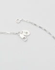 A sterling silver bracelet with a delicate Venetian box design and a lobster clasp closure and branded jewelry tag, minimalist jewelry by Sincerely Chain Co.