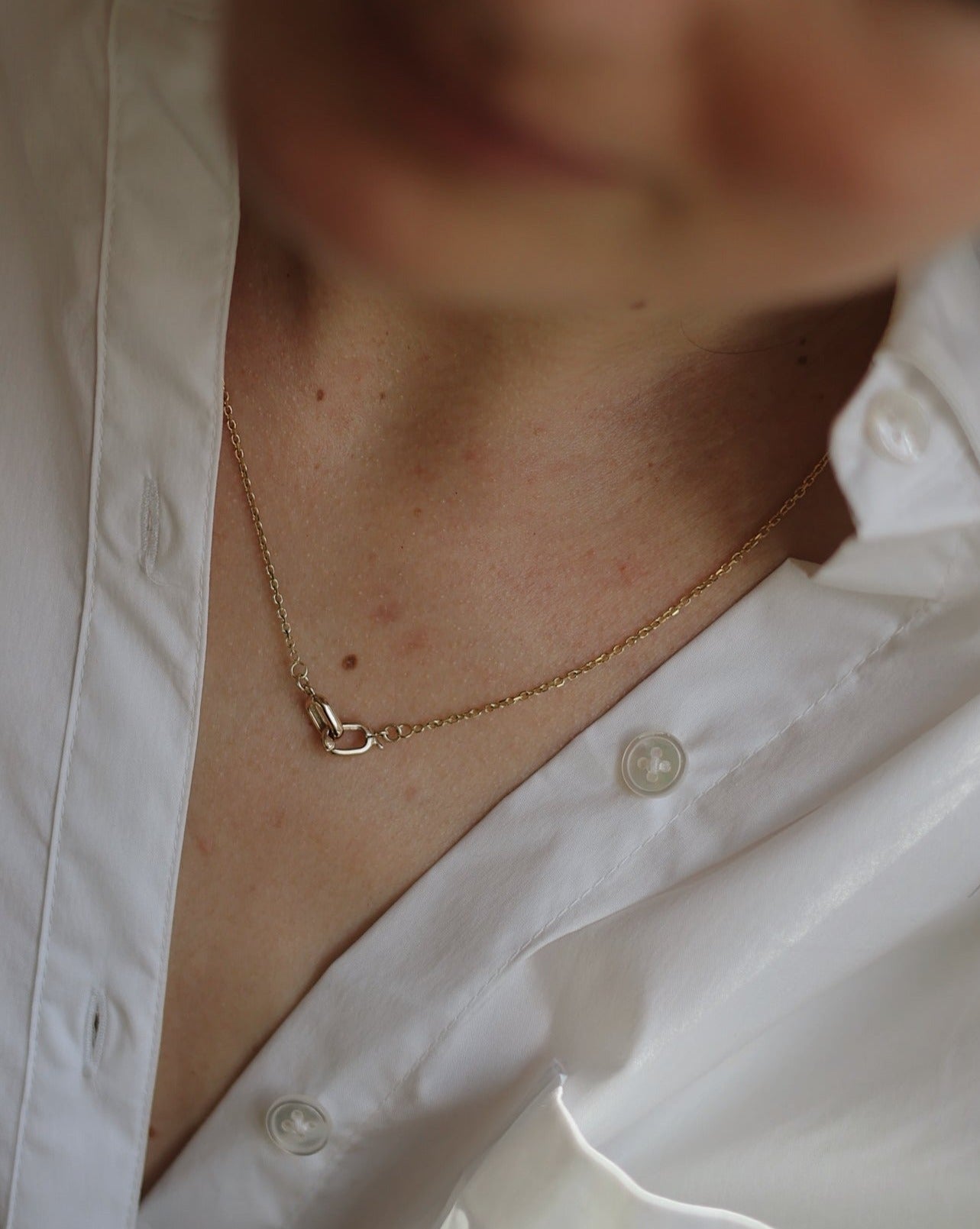 14 karat gold necklace with an front featured clasp that elegantly interlocks