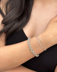 women with tan skin wearing bright silver bracelets