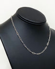 sterling silver paperclip cable chain draped on black model