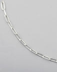 close up of sterling silver chain with diamond cut paperclip links