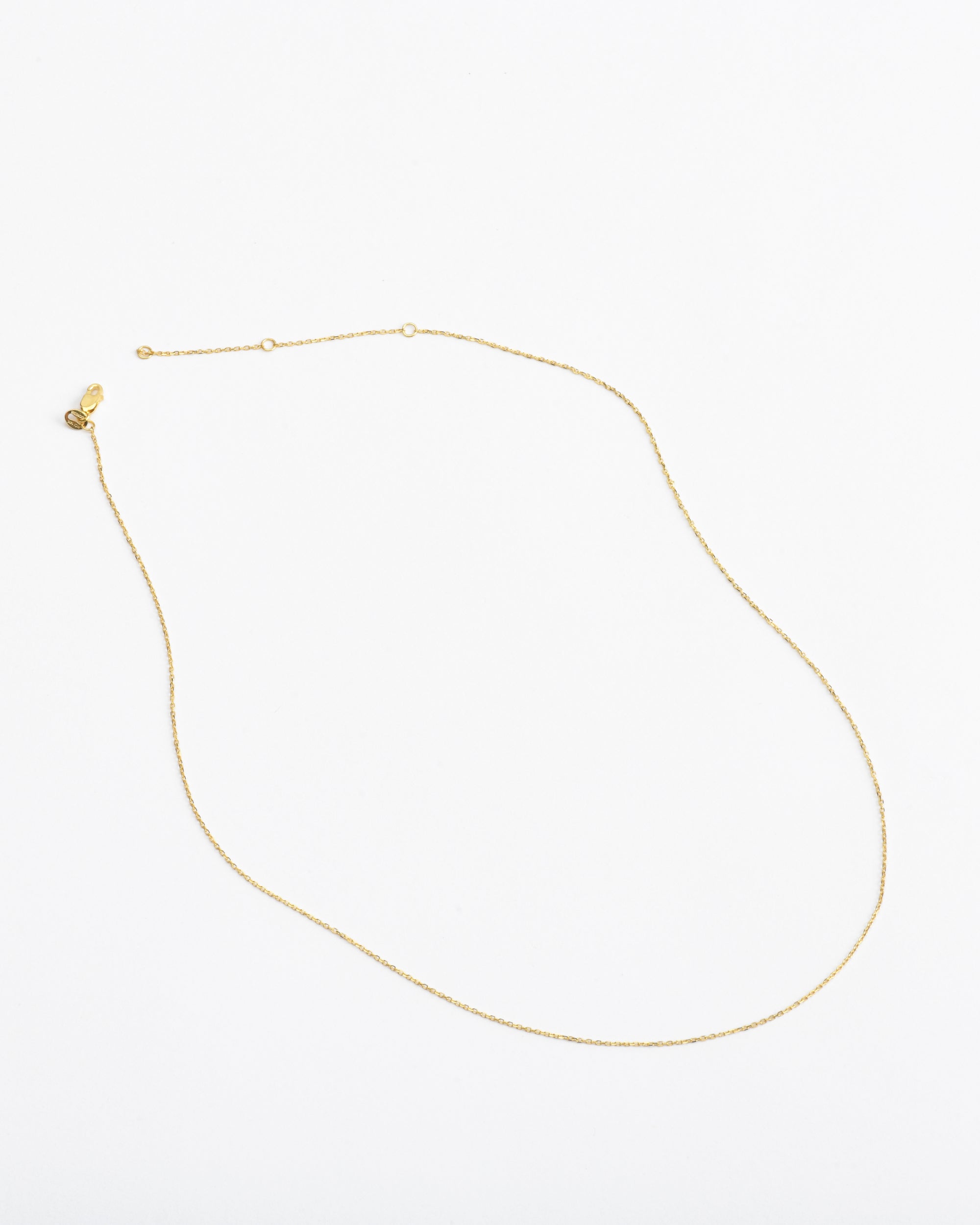 A fine 14k gold cable chain bevel cut for sparkle with three stations for adjustability, modern minimalist jewelry by Sincerely Chain Co.