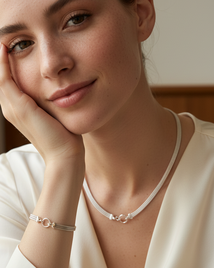 Sterling silver bracelet with a mesh style chain featuring a circular hinge clasp, by Sincerely Chain Co.