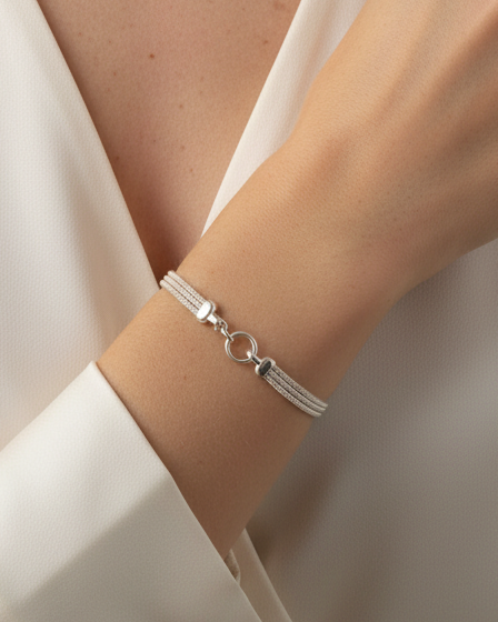 Sterling silver bracelet with a mesh style chain featuring a circular hinge clasp, by Sincerely Chain Co.