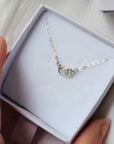 silver and diamond pendant necklace in white gift box