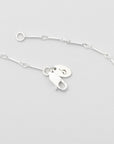 bar and ring chain in silver with logo tag