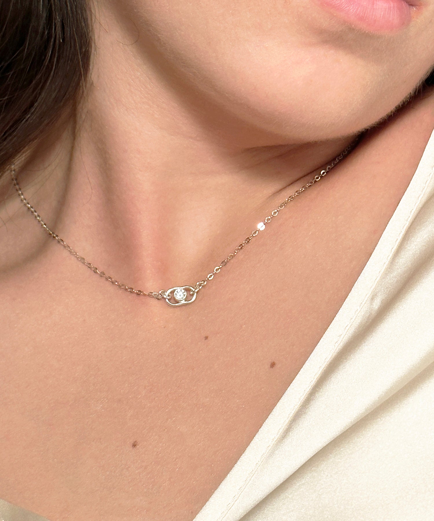 women wearing a diamond charm necklace with a cable chain in sterling silver