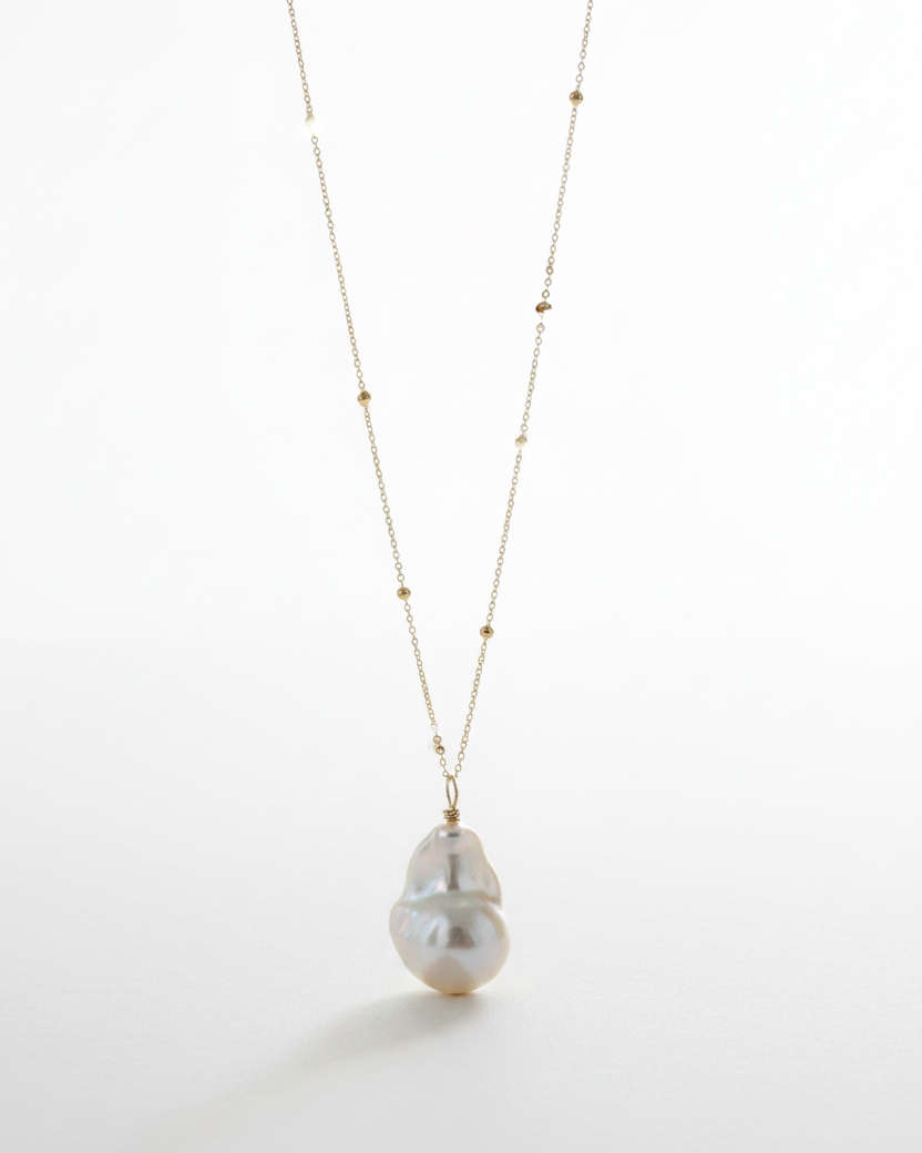 Baroque Pearl and 14k gold Satellite Chain necklace on a white background