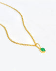 bright 14k gold chain necklace featuring a radiant green gemstone set in gold