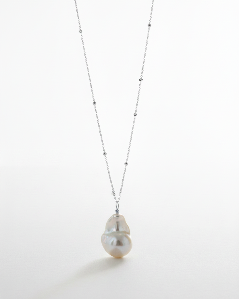 Sterling Silver Baroque Pearl Necklace on a white background, fine jewelry by Sincerely Chain Co.