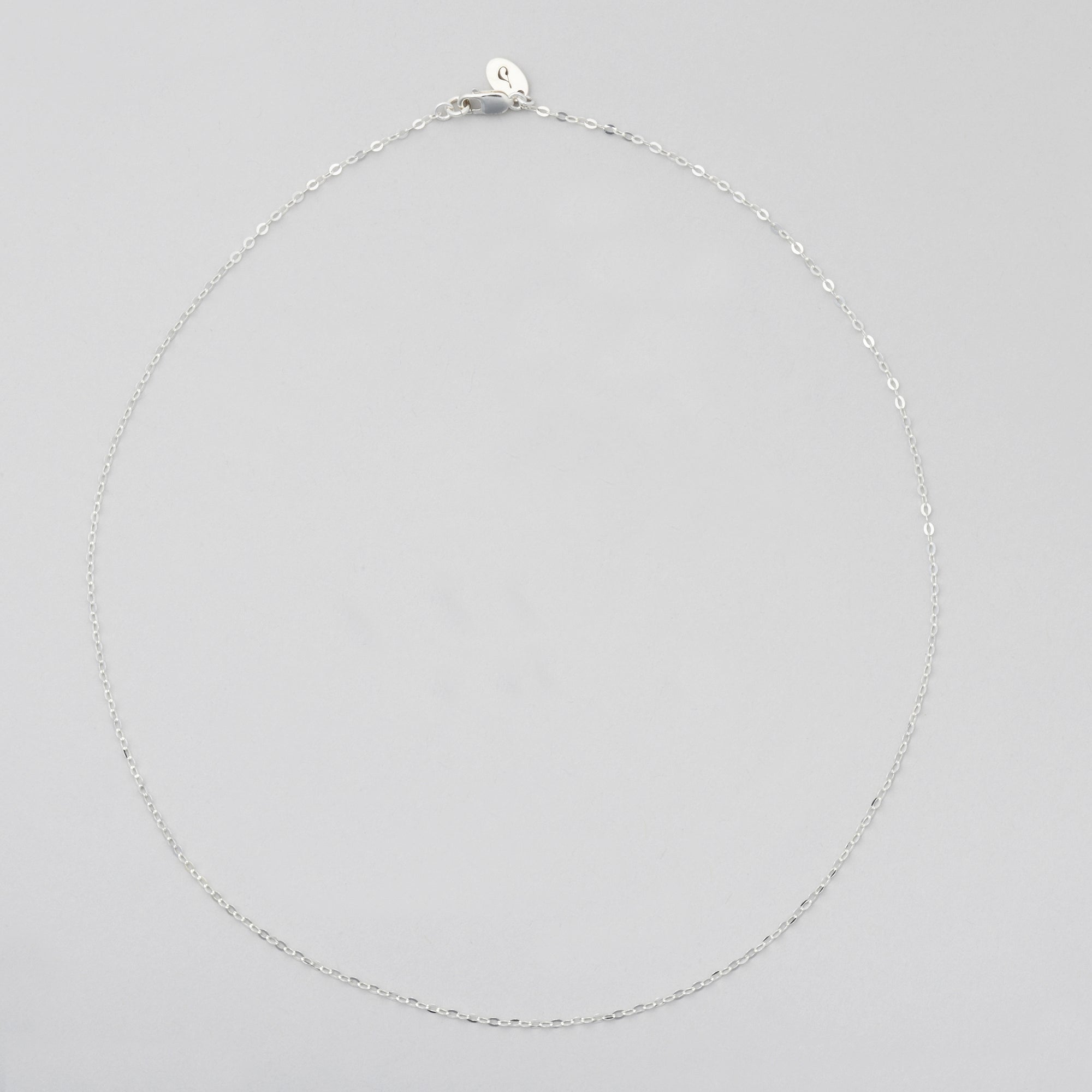 delicate sterling silver cable chain necklace with lobster clasp and sincerely chain co logo