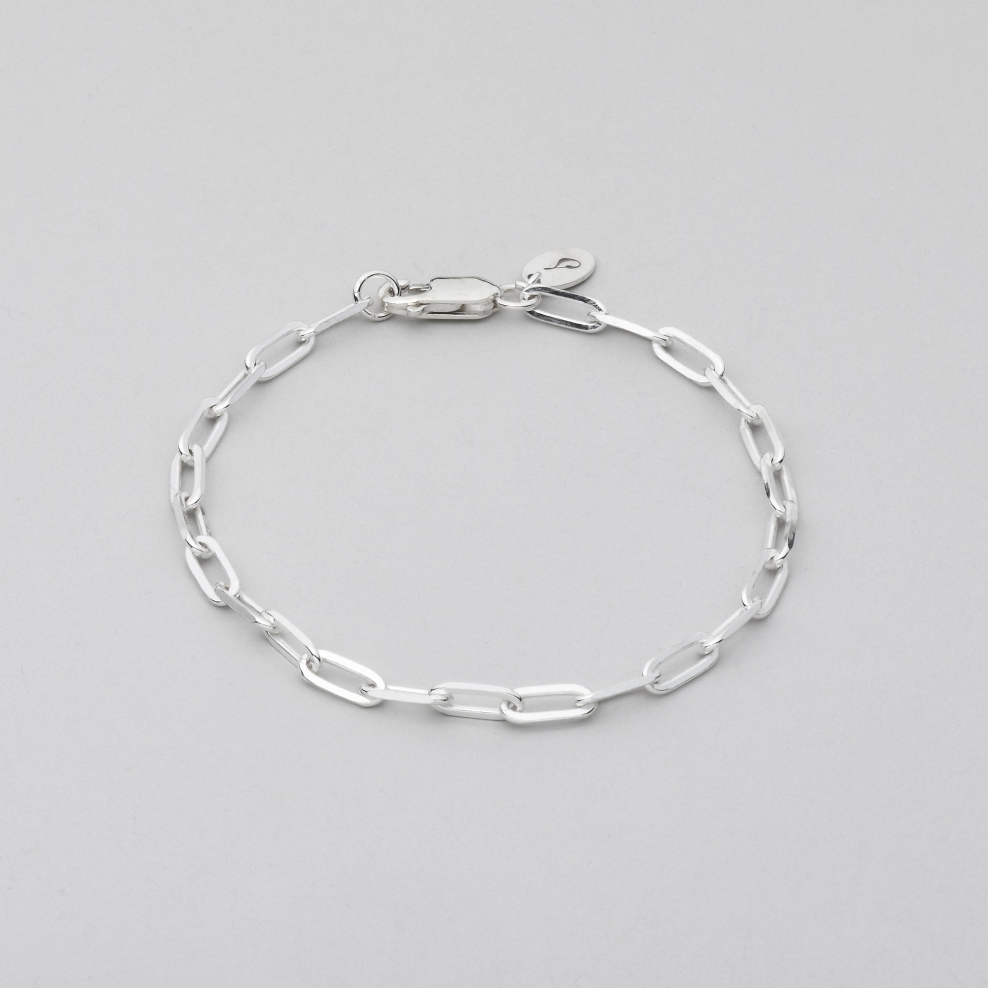 sturdy 9 mm links sterling silver bracelet on grey background